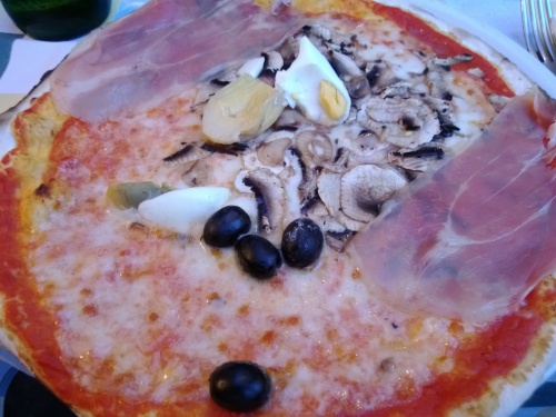 Pizza with ham, olives, mushroom